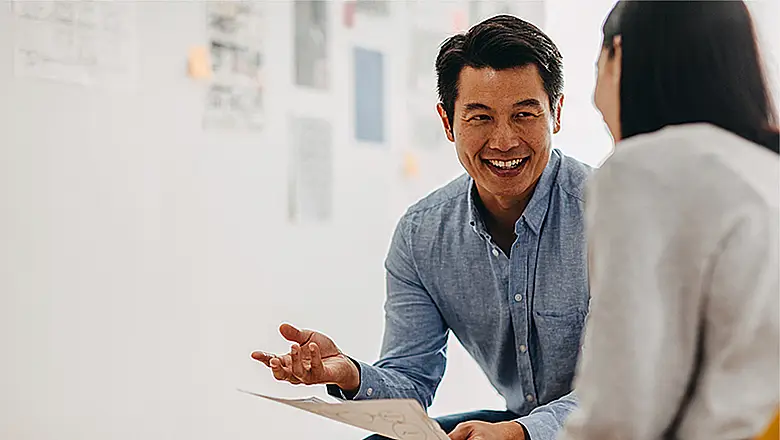 having conversation with his financial advisor