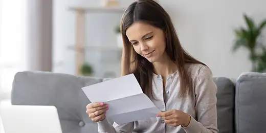 female student looking over loan terms