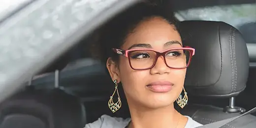 Happy woman purchasing car
