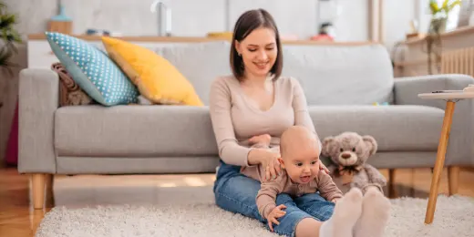 mother playing with baby
