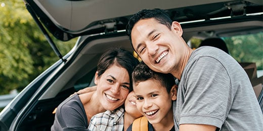 family sitting in their tailgate
