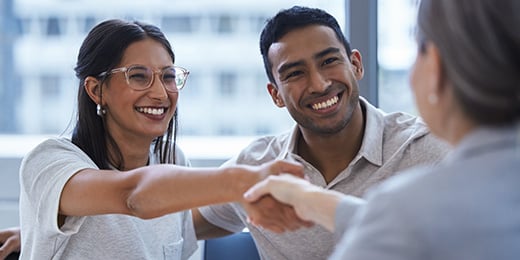 couple making a deal with a financial planner