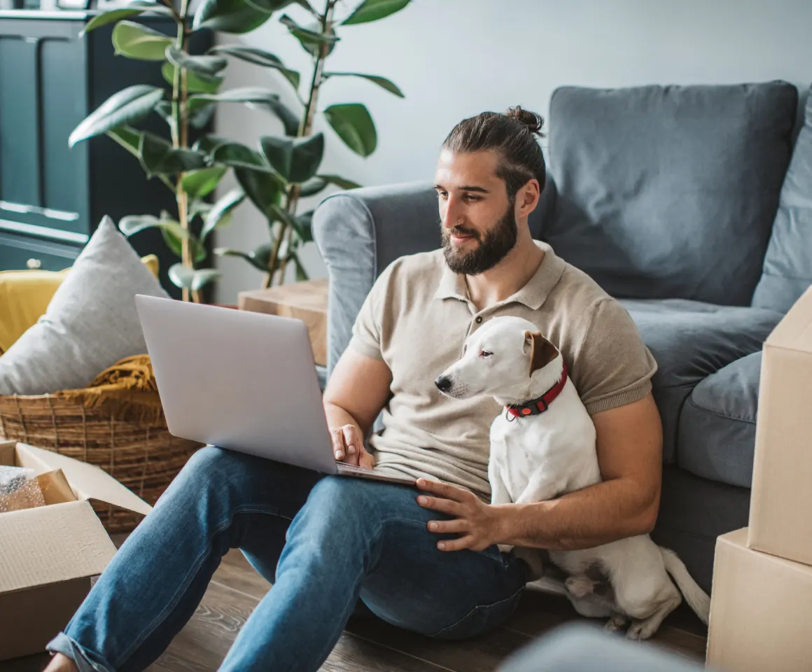 guy with his dog sitting on the couch